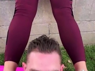Submissive guy treated to a foot fetish threesome outside