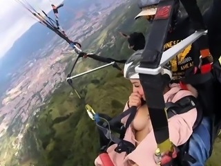 Young skydiver with big tits pleases herself with a pink toy