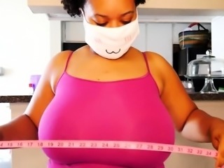 Big tittied ebony milf measuring her chest size on webcam