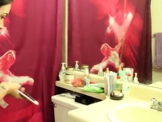 Naughty teen with shaved pussy peeing in the bathroom sink
