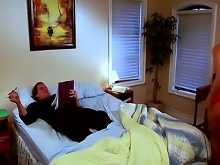 Evan Stone and mature, but sexy blonde Julia Ann laying in the bed before...